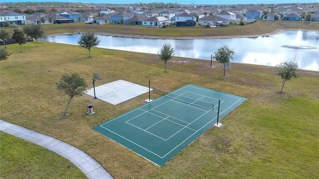 an aerial view of a house with a lake view