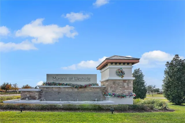 a view of a hallway with a chandelier