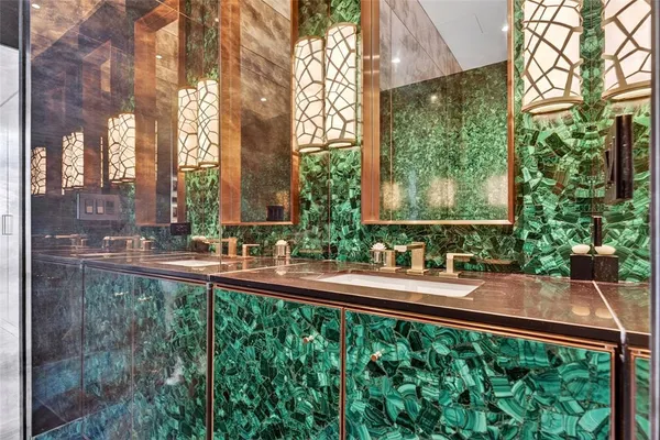 a wooden bench sitting in front of a building