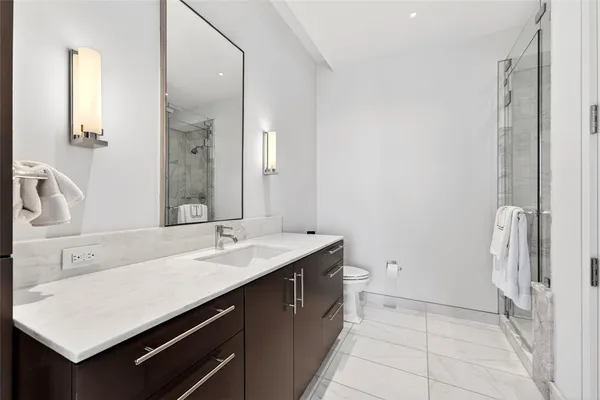 a bathroom with a sink a vanity and a mirror