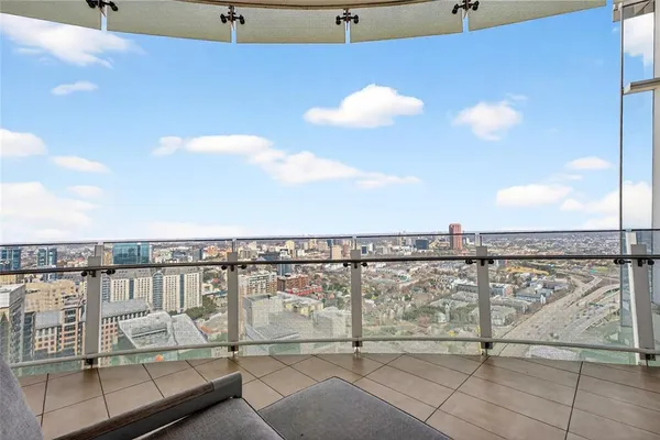 a view of roof deck with furniture