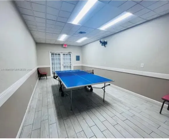 a view of swimming pool with a table and chairs