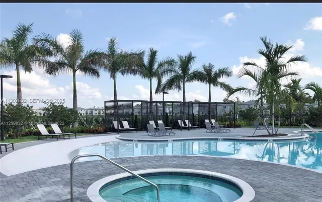 a bedroom with a bed and a cabinet