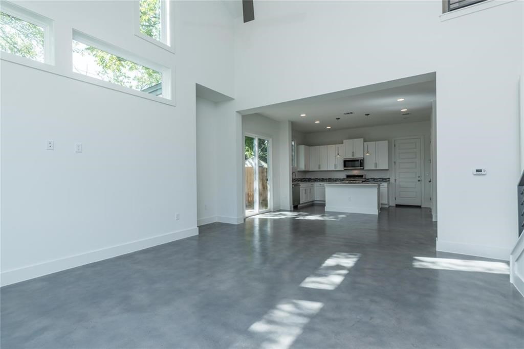 1403 Arcadia Avenue, Unit A Austin, TX 78757 - Photo 11 of 35 a view of kitchen with windows and refrigerator