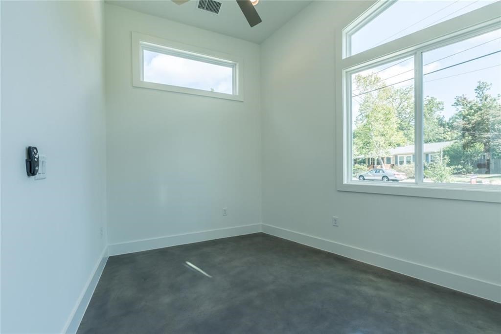 1403 Arcadia Avenue, Unit A Austin, TX 78757 - Photo 15 of 35 an empty room with a window
