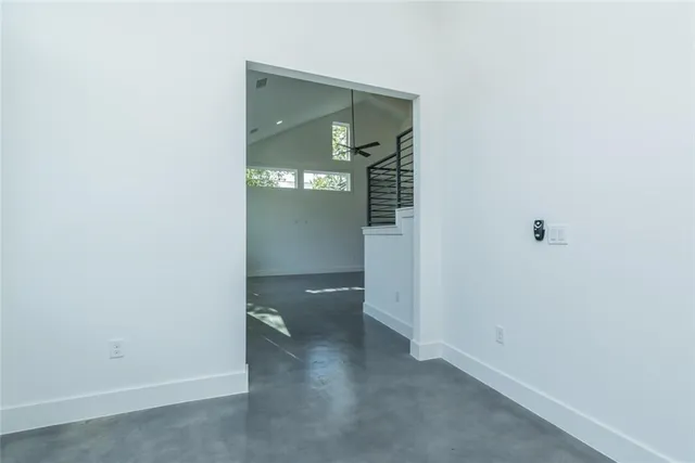 a view of a hallway with wooden shelves