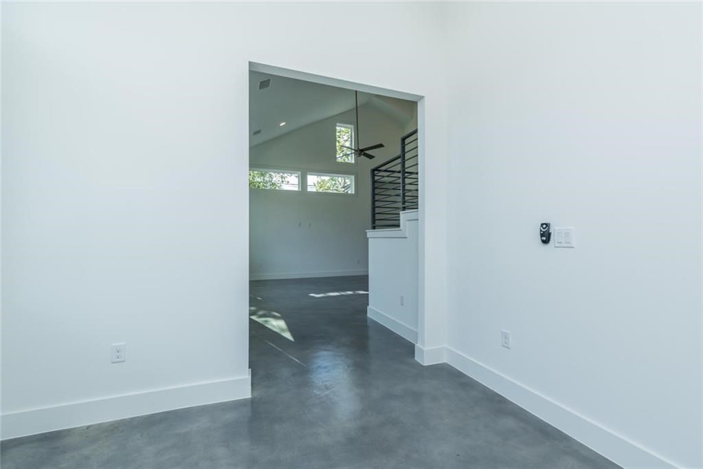 1403 Arcadia Avenue, Unit A Austin, TX 78757 - Photo 16 of 35 a view of a hallway with wooden shelves