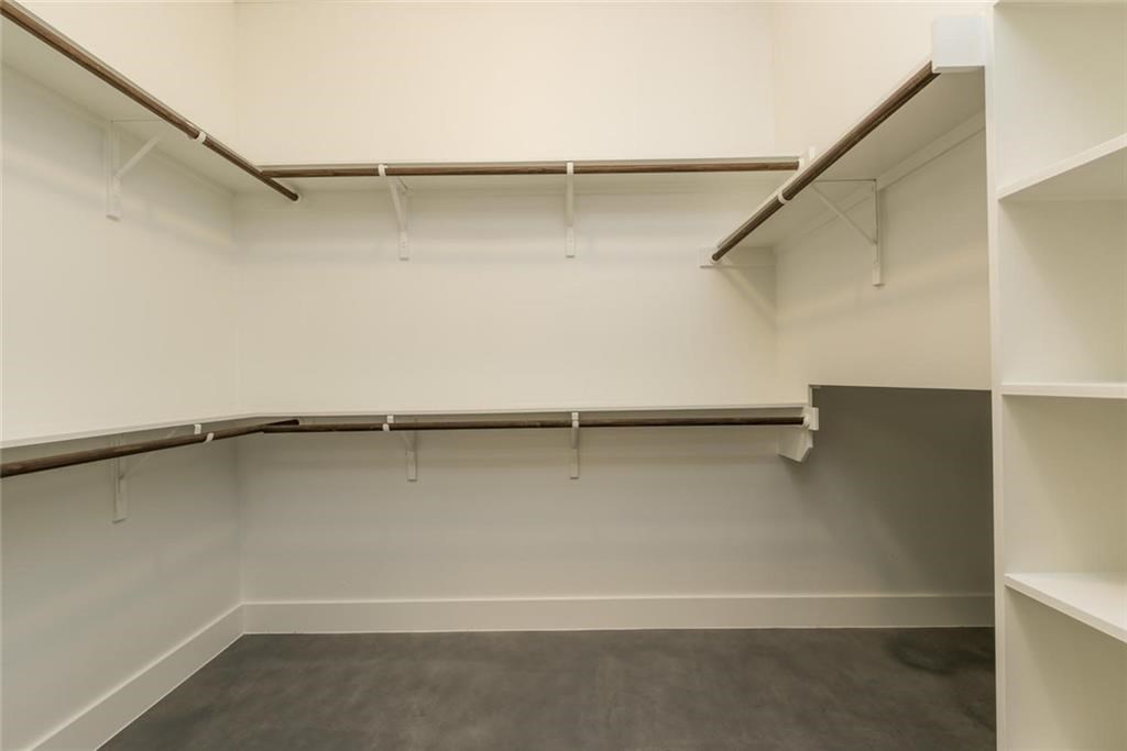 1403 Arcadia Avenue, Unit A Austin, TX 78757 - Photo 19 of 35 a view of an empty walk in closet