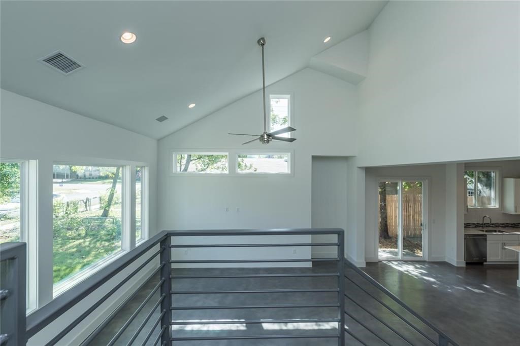 1403 Arcadia Avenue, Unit A Austin, TX 78757 - Photo 21 of 35 a view of room window and wooden floor