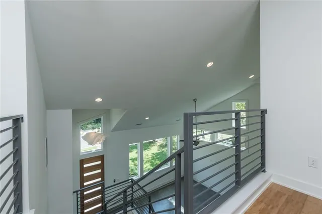 a view of entryway and hall with wooden floor