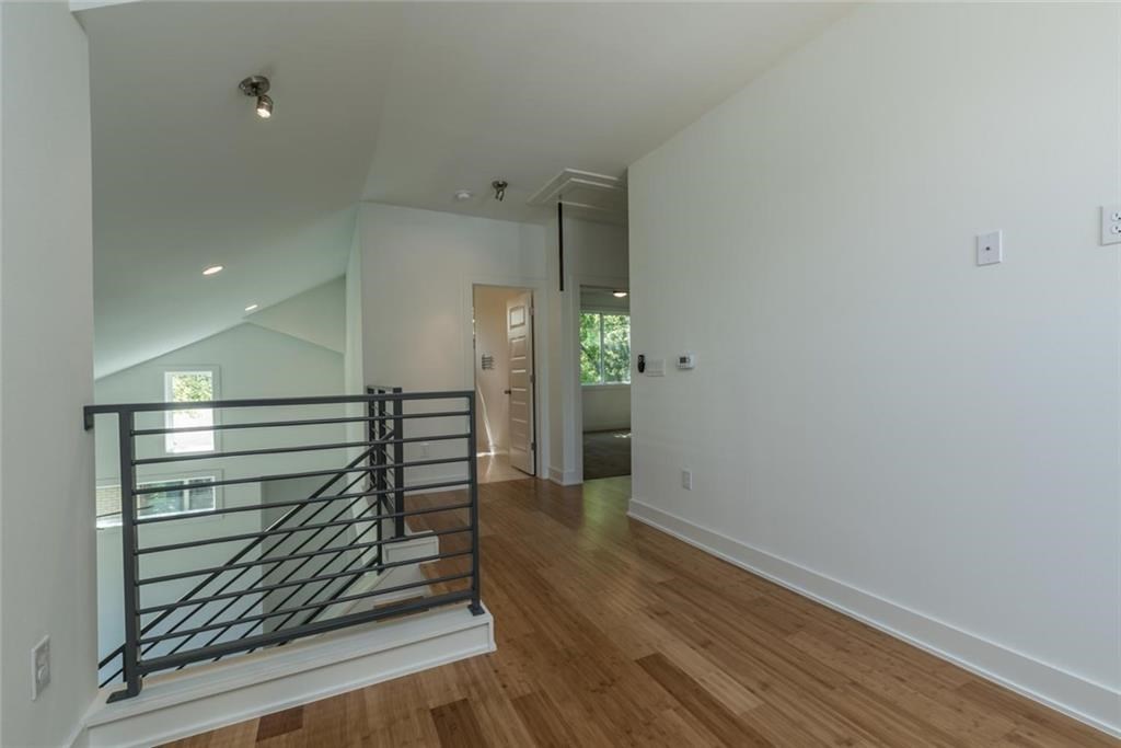 1403 Arcadia Avenue, Unit A Austin, TX 78757 - Photo 24 of 35 a view of entryway with wooden floor