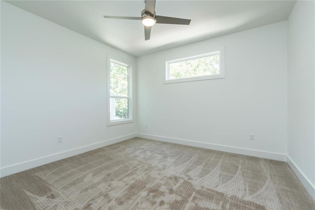 1403 Arcadia Avenue, Unit A Austin, TX 78757 - Photo 26 of 35 a view of an empty room with a window