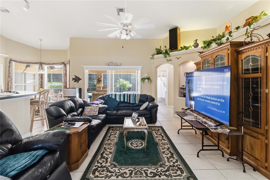3225 Canoe Creek Road St. Cloud, FL 34772 - Photo 8 of 30 a living room with furniture a fireplace and rug floor