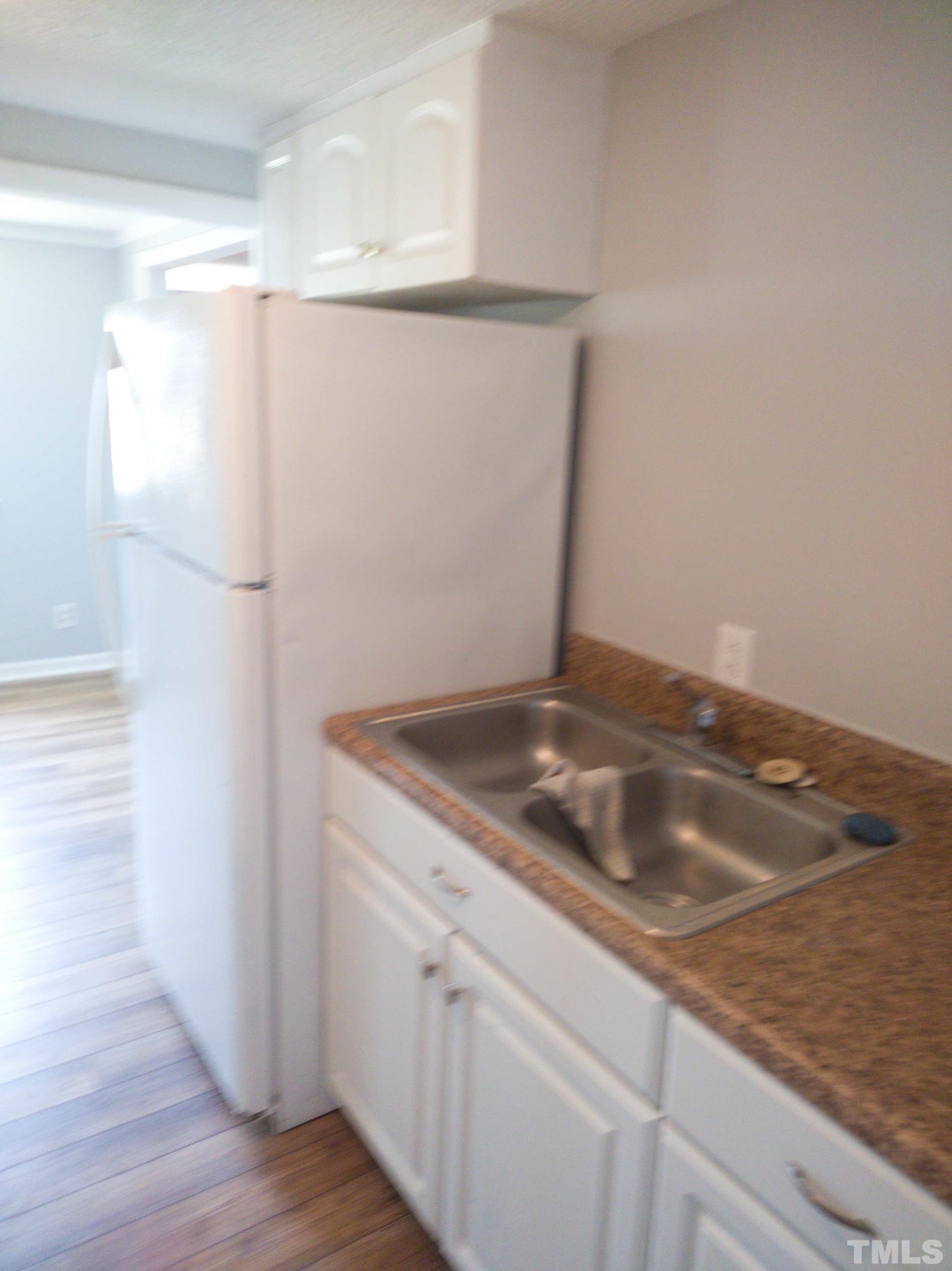 563 Williams Road Spring Hope, NC 27882 - Photo 13 of 16 a bathroom with a sink and vanity