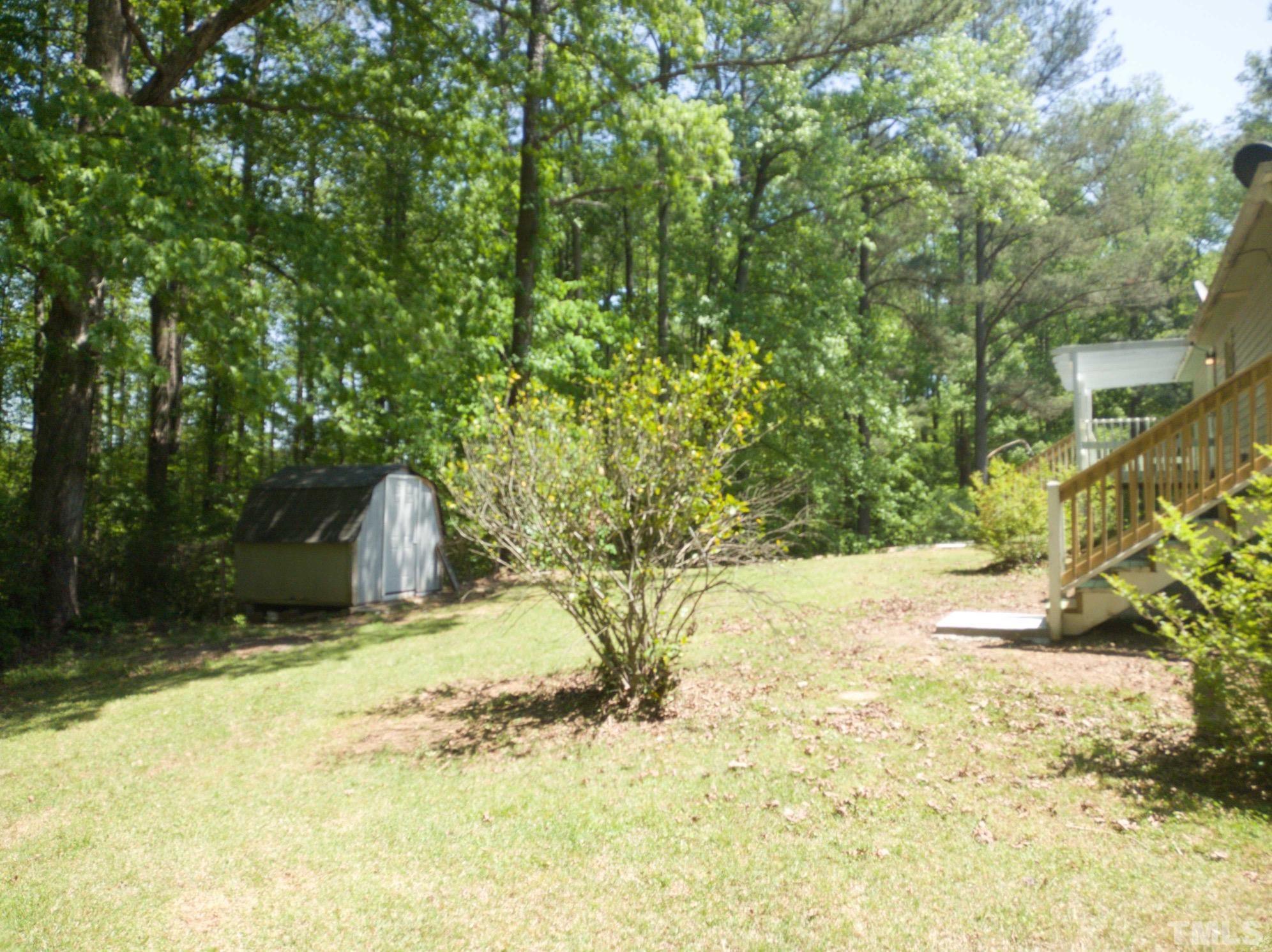 563 Williams Road Spring Hope, NC 27882 - Photo 16 of 16 a view of a yard with large trees