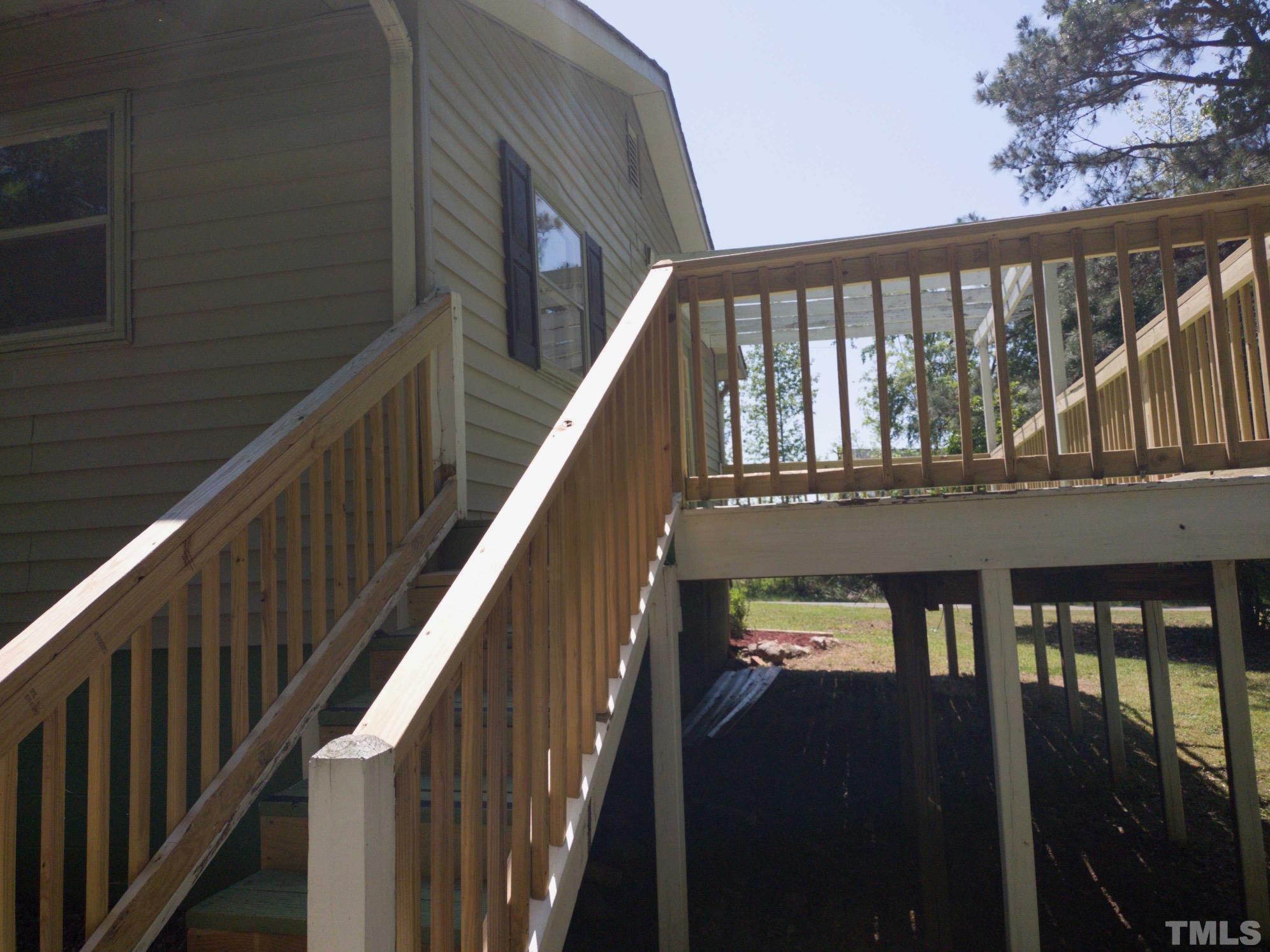 563 Williams Road Spring Hope, NC 27882 - Photo 5 of 16 a view of a balcony with wooden floor