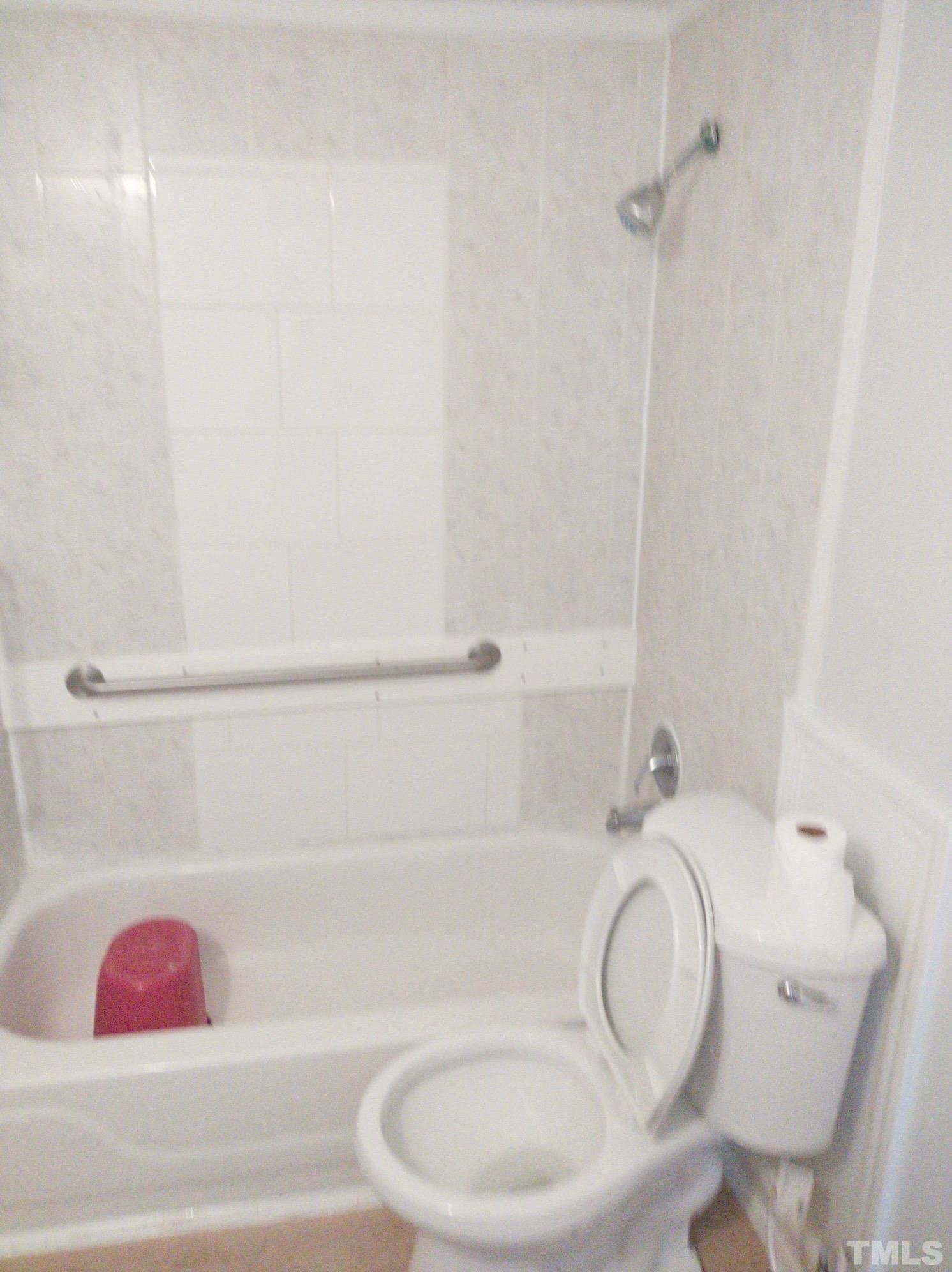 563 Williams Road Spring Hope, NC 27882 - Photo 6 of 16 a bathroom with a toilet and bathtub