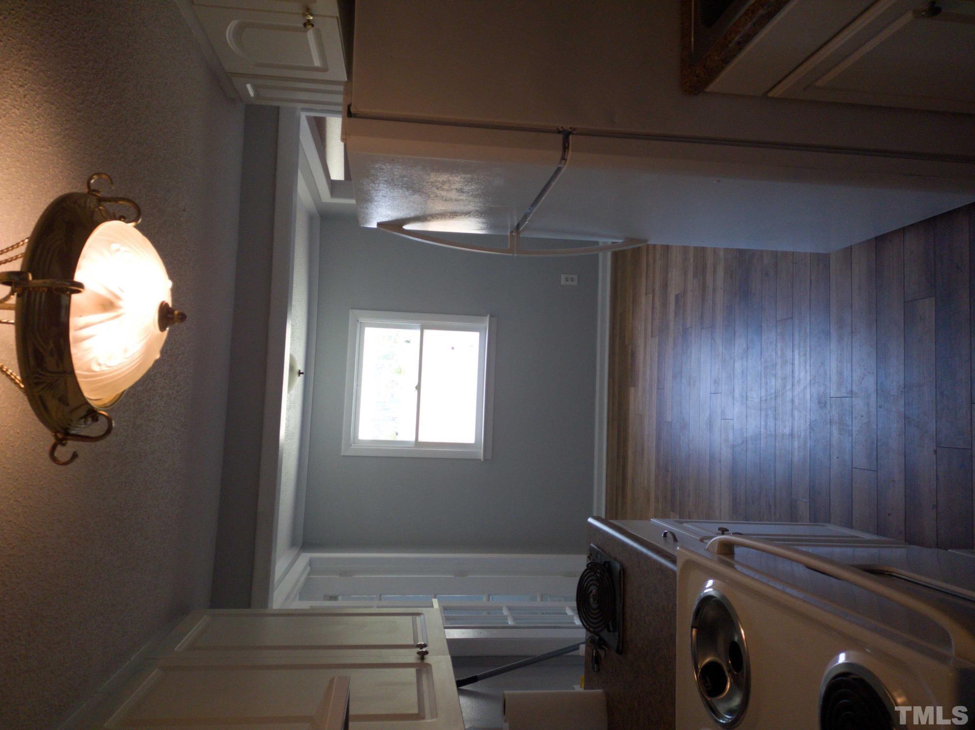563 Williams Road Spring Hope, NC 27882 - Photo 7 of 16 a view of livingroom with washer and dryer