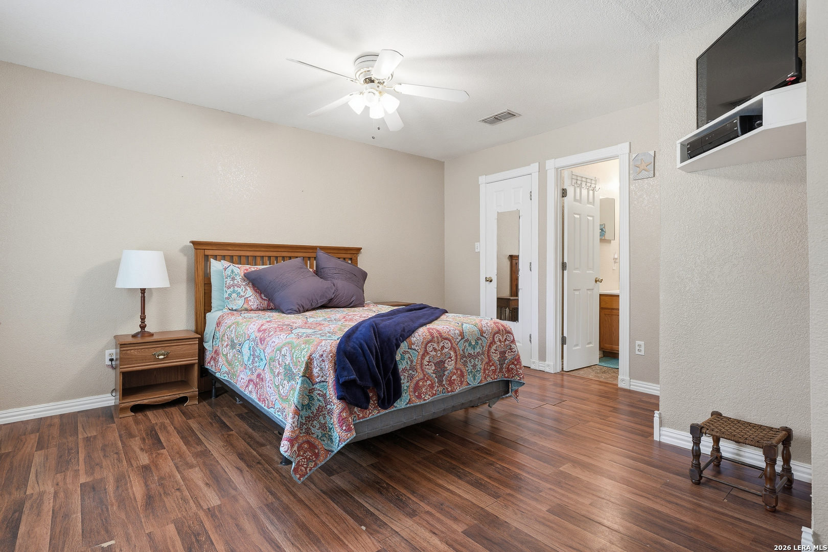 514 North 6th Street Fulton, TX 78358 - Photo 15 of 34 a bedroom with a bed and wooden floor