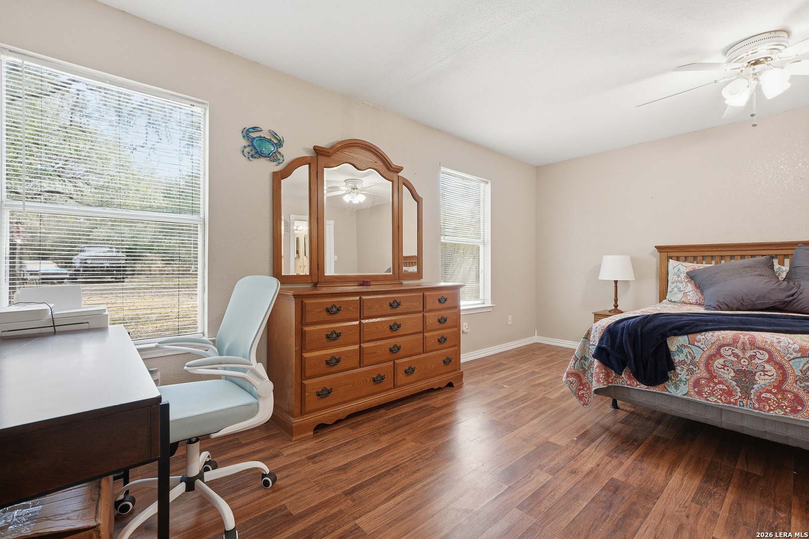 514 North 6th Street Fulton, TX 78358 - Photo 16 of 34 a bedroom with a bed and wooden floor