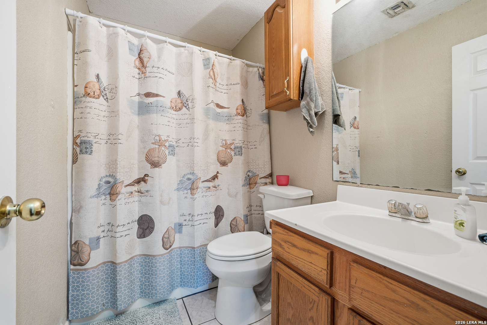 514 North 6th Street Fulton, TX 78358 - Photo 19 of 34 a bathroom with a sink toilet and shower