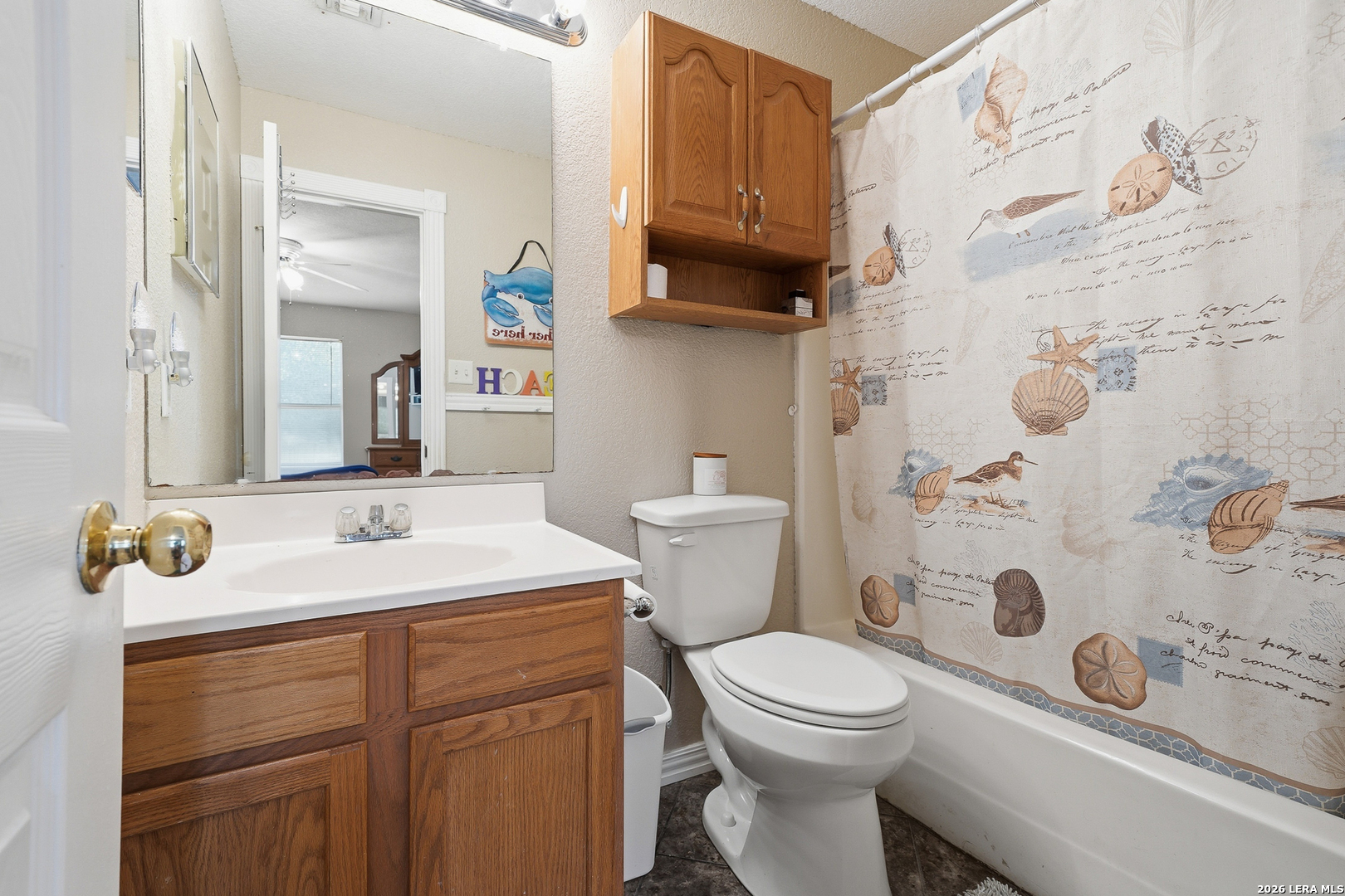514 North 6th Street Fulton, TX 78358 - Photo 20 of 34 a bathroom with a sink toilet and shower
