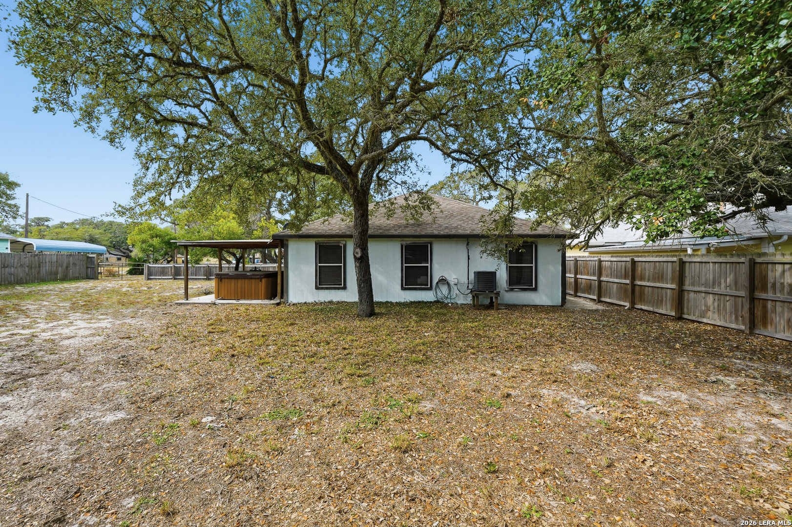 514 North 6th Street Fulton, TX 78358 - Photo 25 of 34 a view of a yard in front of a house with large tree