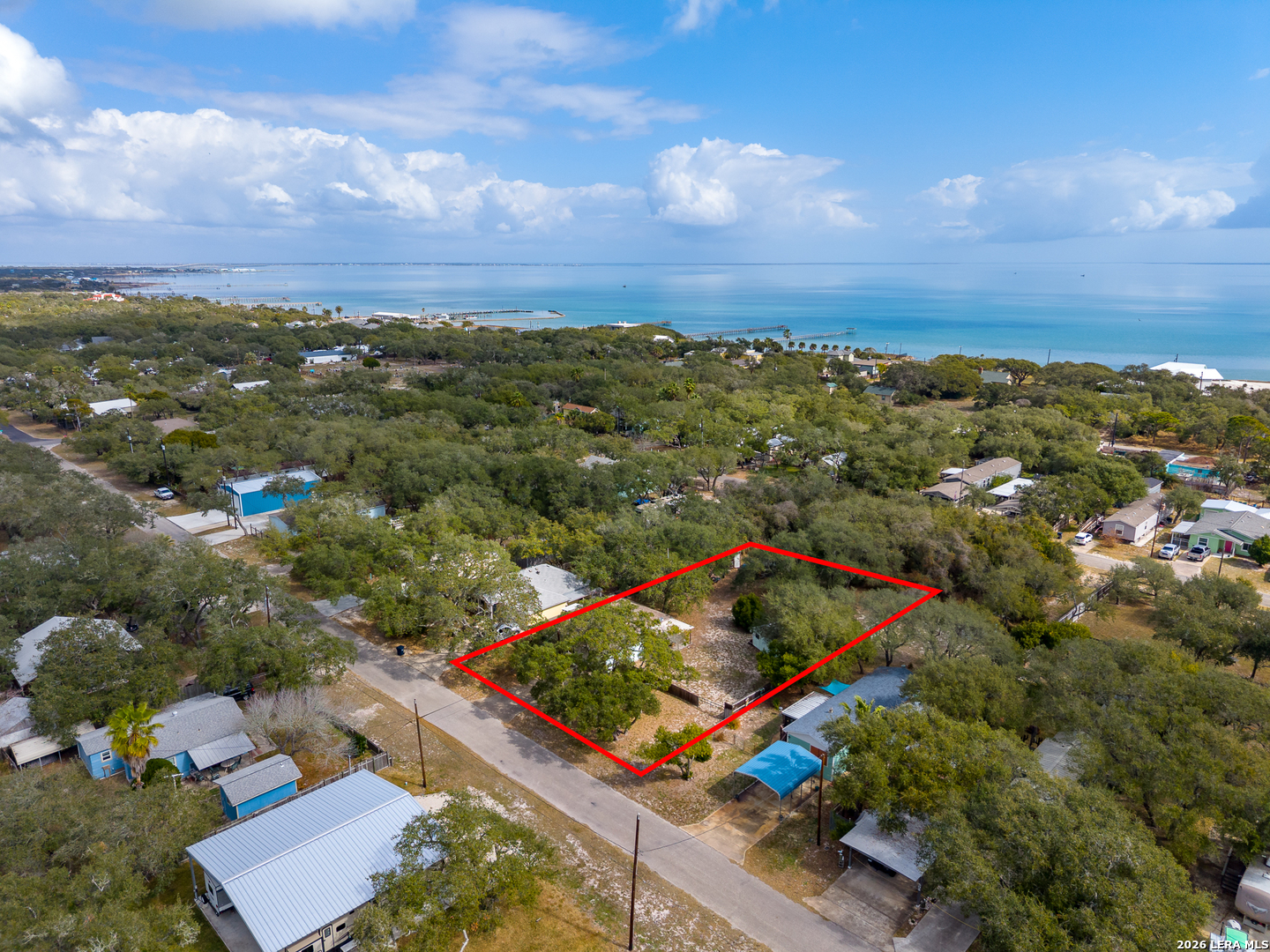 514 North 6th Street Fulton, TX 78358 - Photo 34 of 34 an aerial view of residential house with outdoor space and trees