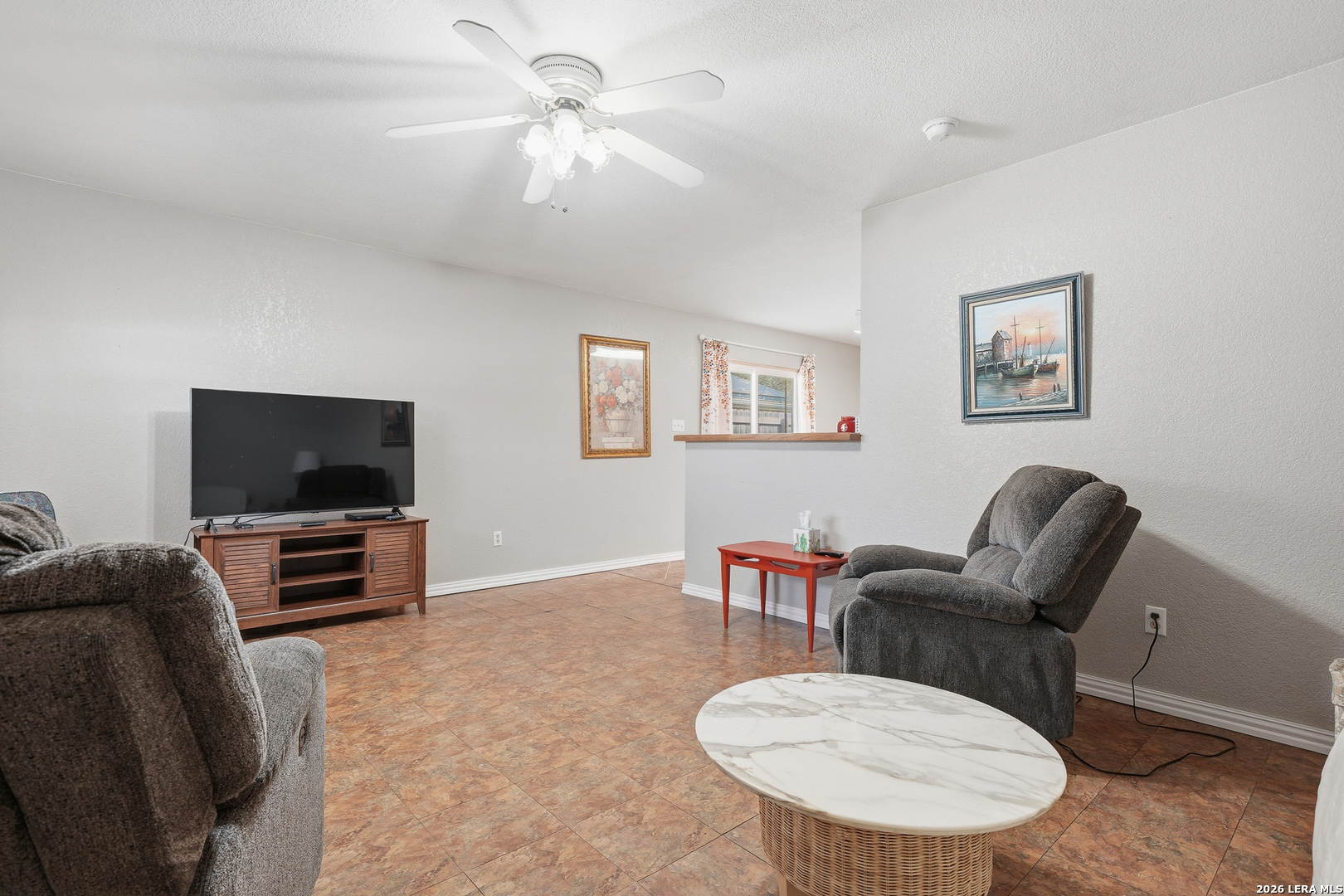 514 North 6th Street Fulton, TX 78358 - Photo 6 of 34 a living room with furniture and a flat screen tv