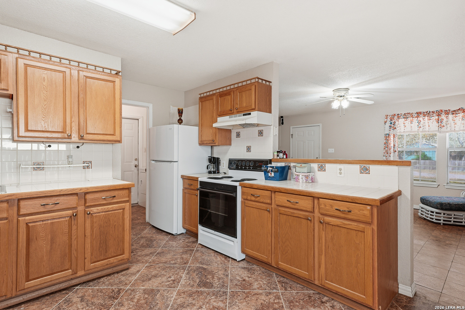514 North 6th Street Fulton, TX 78358 - Photo 7 of 34 a kitchen with a sink a stove and cabinets