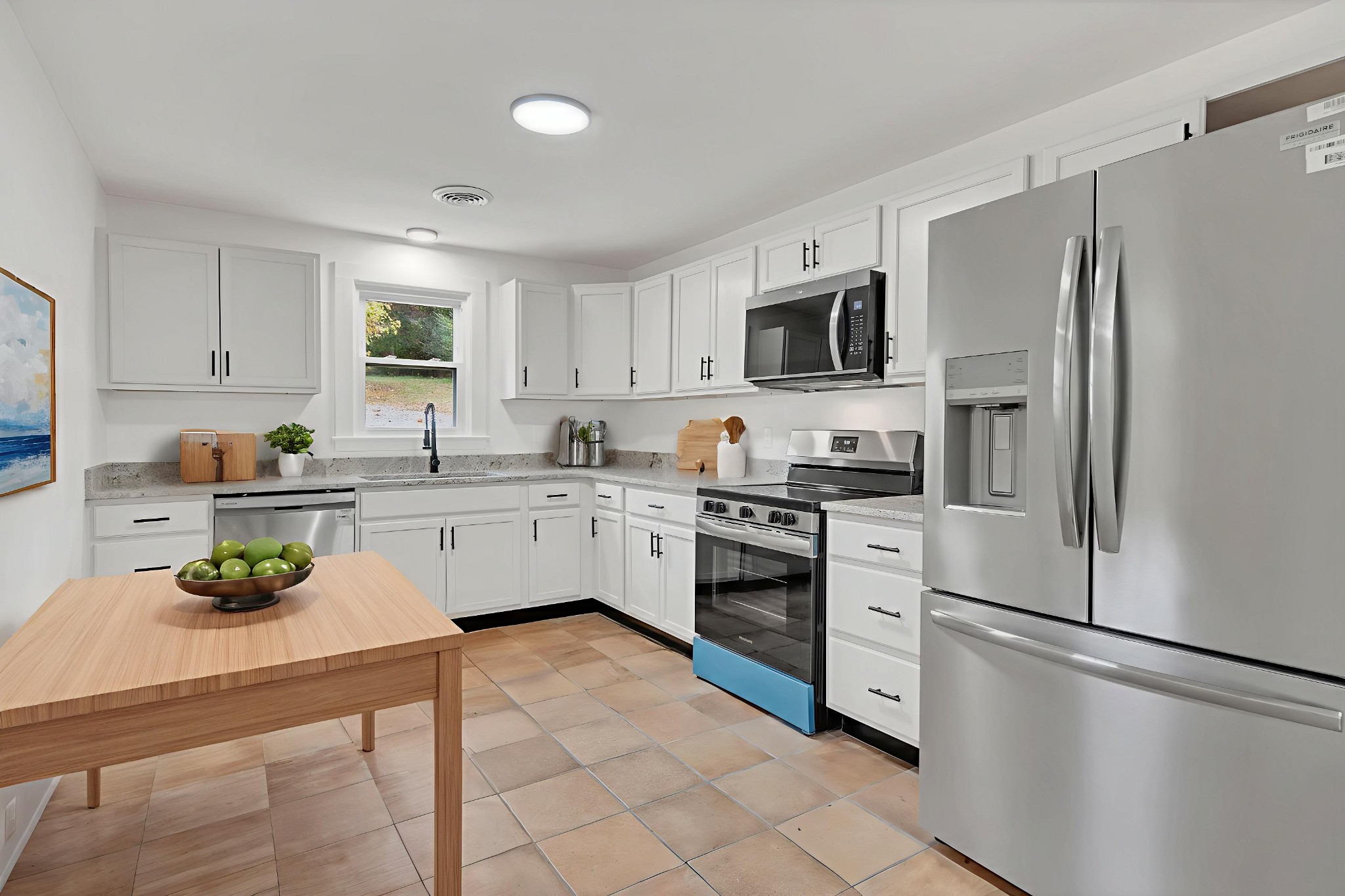 5060 Drakes Branch Road Nashville, TN 37218 - Photo 11 of 43 a kitchen with stainless steel appliances a refrigerator sink and white cabinets
