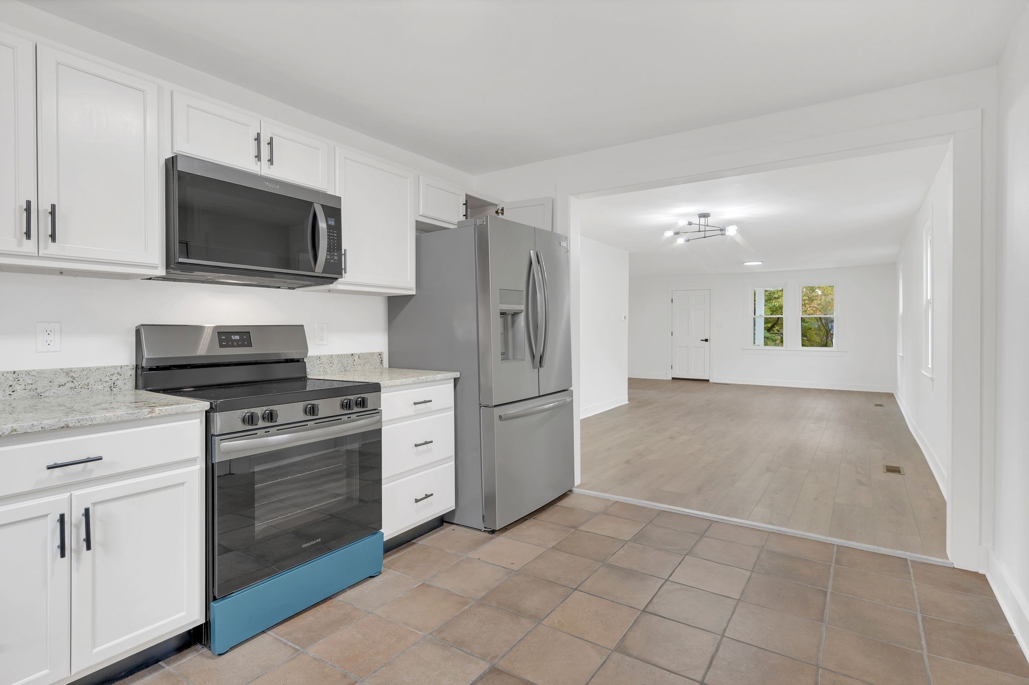 5060 Drakes Branch Road Nashville, TN 37218 - Photo 13 of 43 a kitchen with a stove top oven and refrigerator