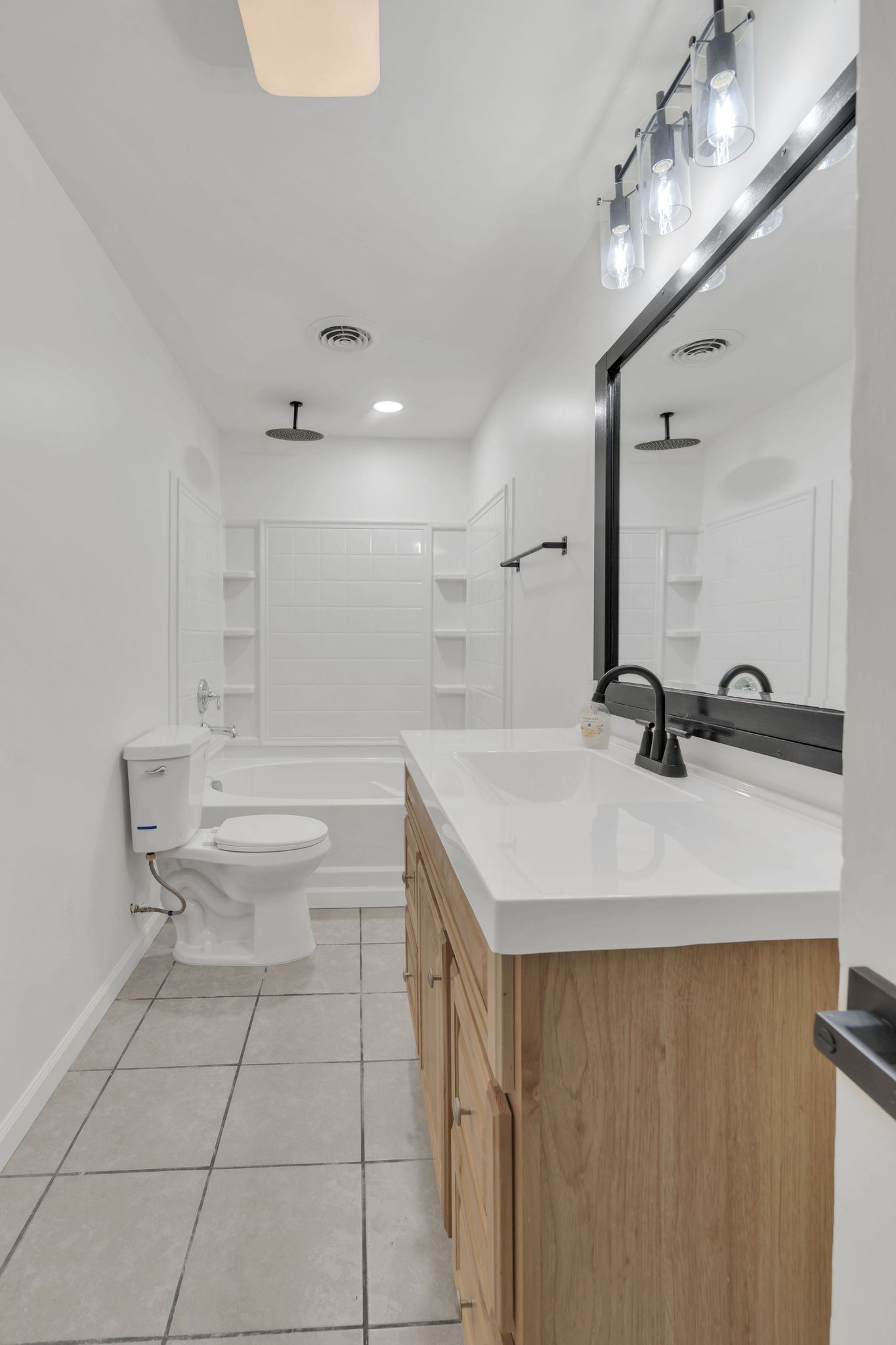 5060 Drakes Branch Road Nashville, TN 37218 - Photo 17 of 43 a bathroom with a sink a toilet a mirror and shower