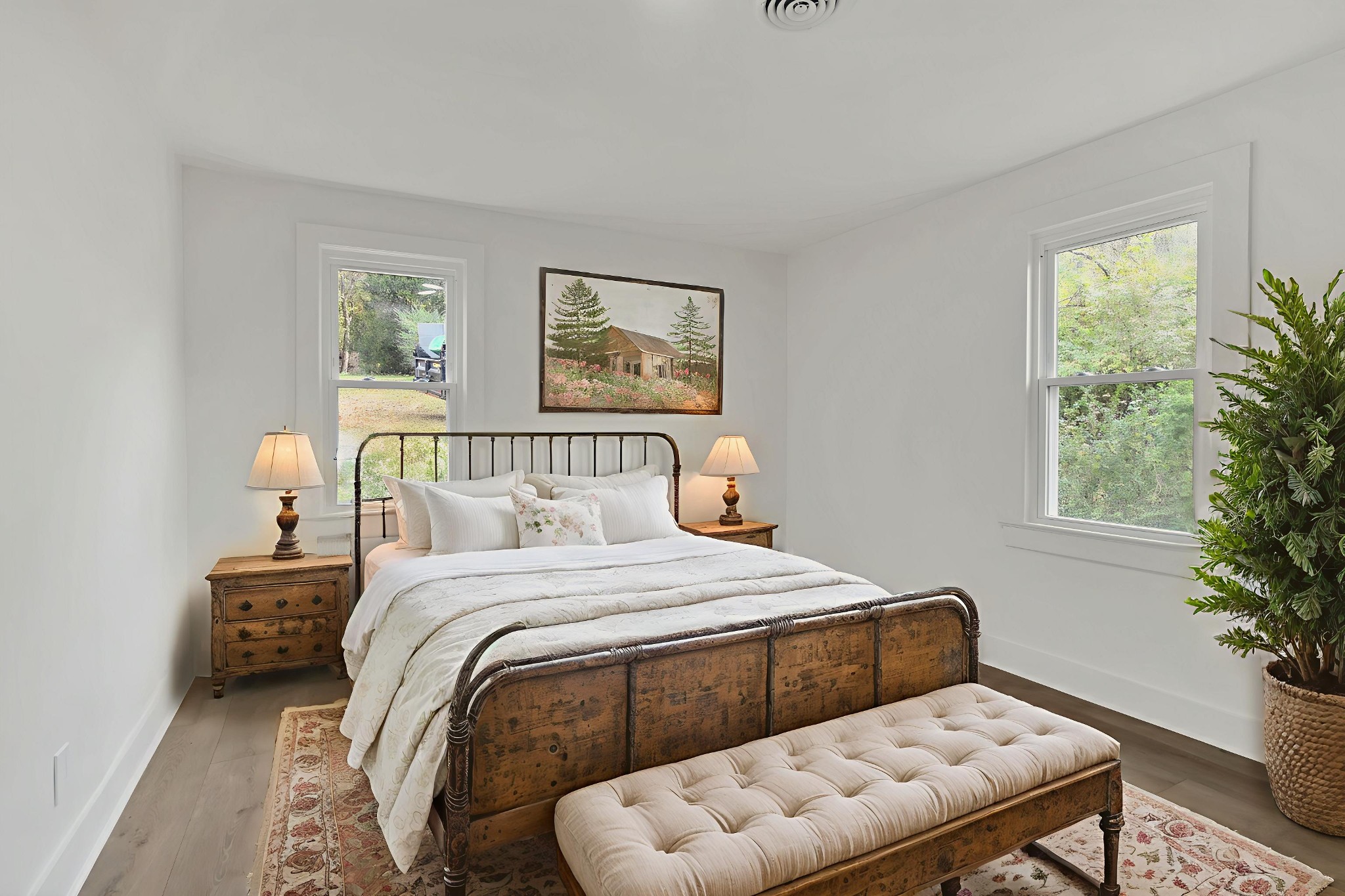 5060 Drakes Branch Road Nashville, TN 37218 - Photo 18 of 43 a bedroom with a bed and a potted plant