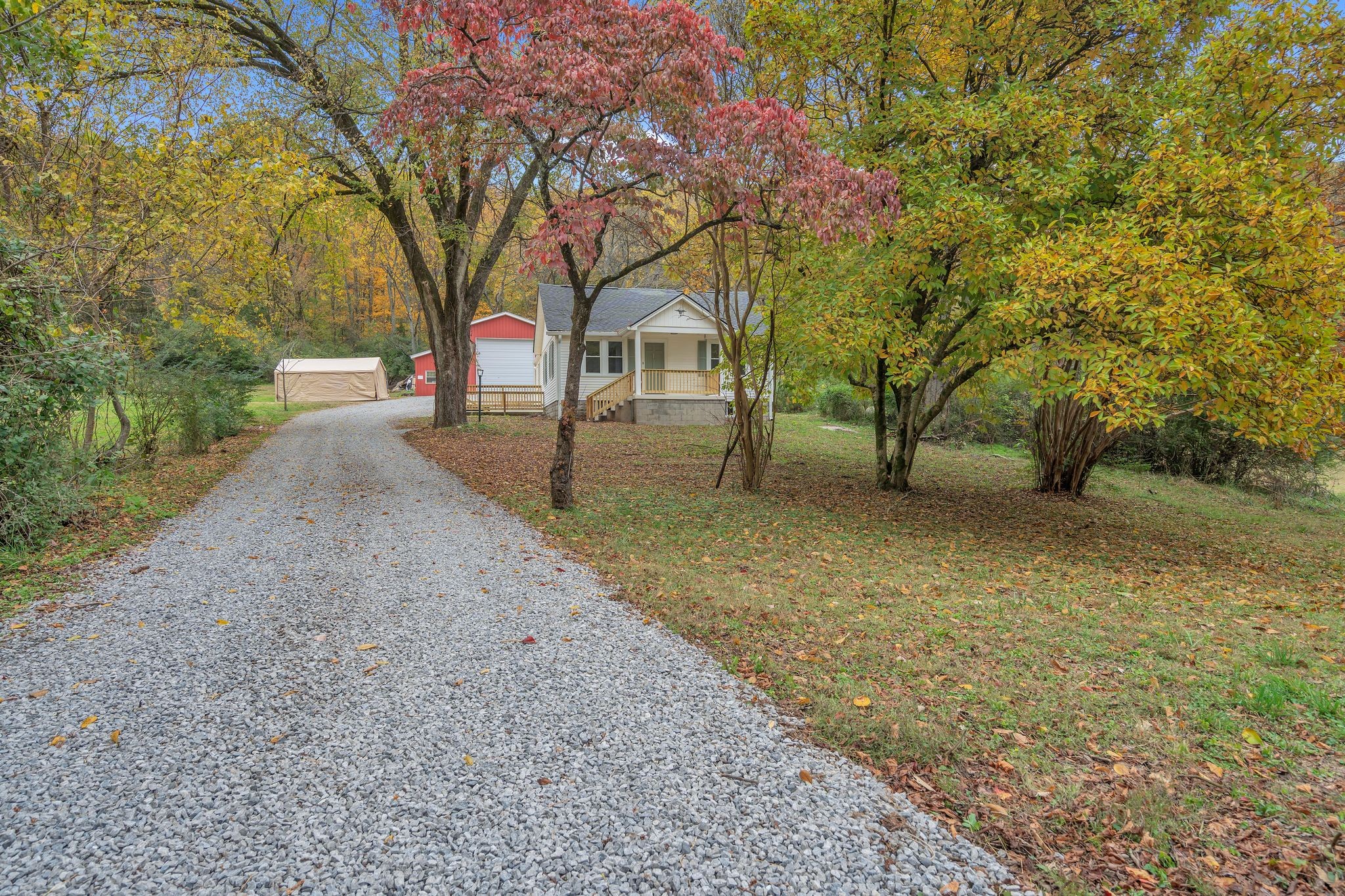 5060 Drakes Branch Road Nashville, TN 37218 - Photo 3 of 43 a house with trees in front of it