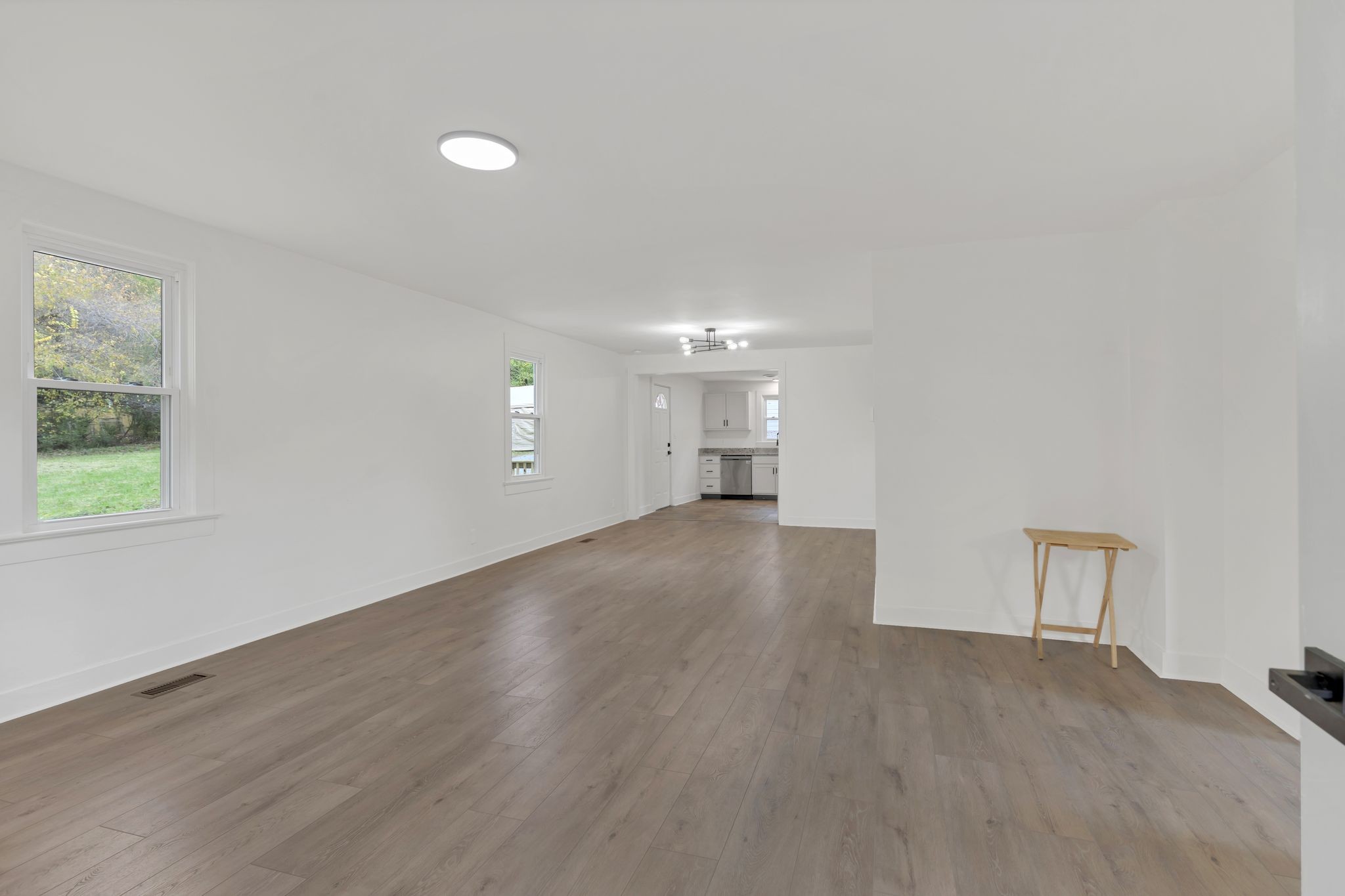 5060 Drakes Branch Road Nashville, TN 37218 - Photo 6 of 43 a view of empty room with wooden floor and fan