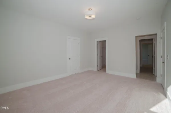 a view of an empty room and closet