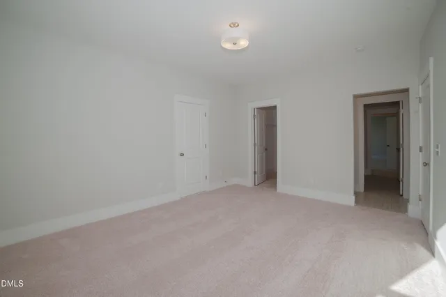 a view of an empty room and closet