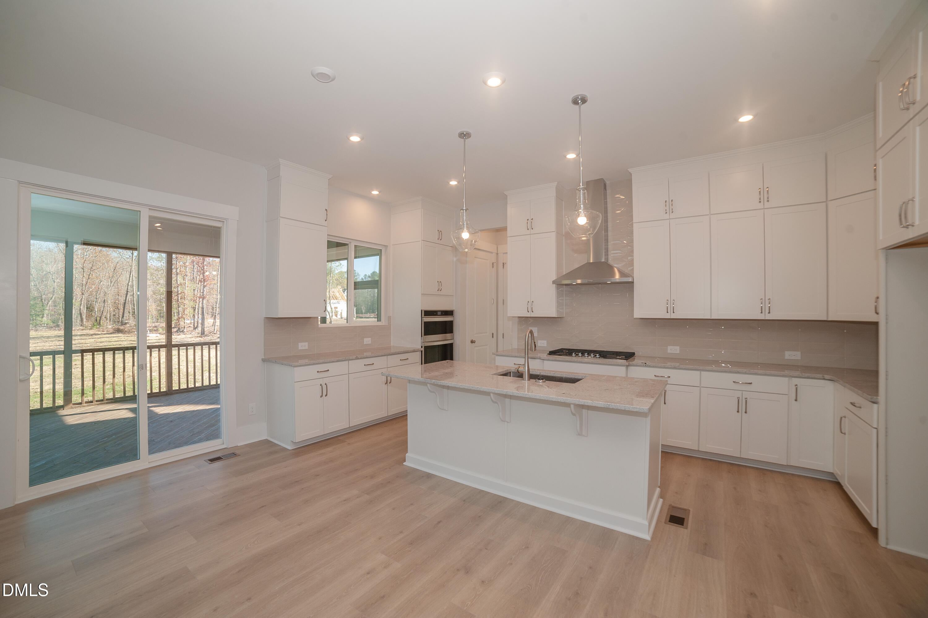 2 Wolf Tree Way Efland, NC 27243 - Photo 5 of 29 a large kitchen with kitchen island a sink stainless steel appliances and cabinets