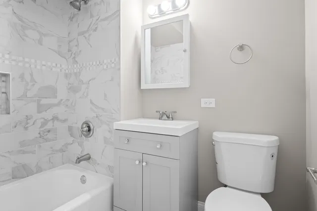 a bathroom with a sink a toilet and a bathtub