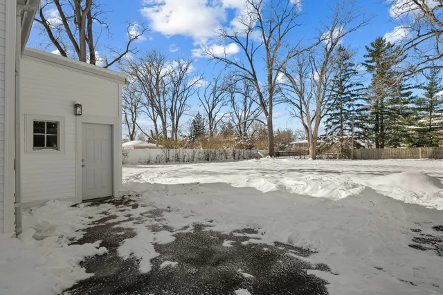 a view of yard covered with snow