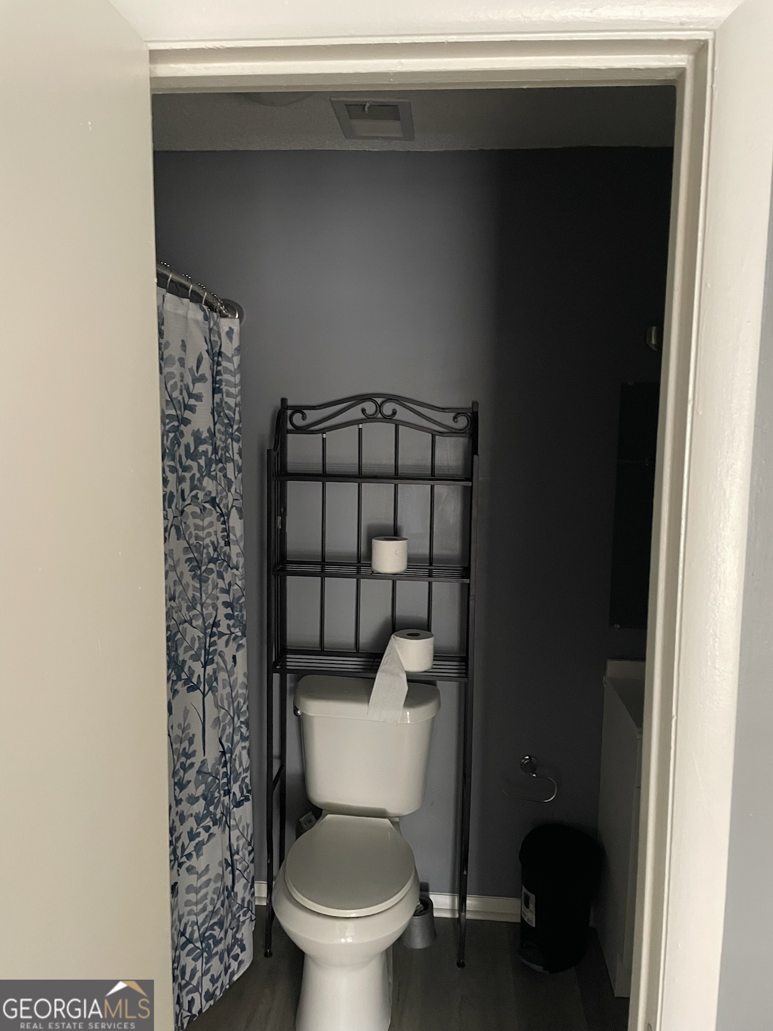 4701 Flat Shoals Road, Unit 25F Union City, GA 30291 - Photo 15 of 21 a white toilet sitting next to a shower