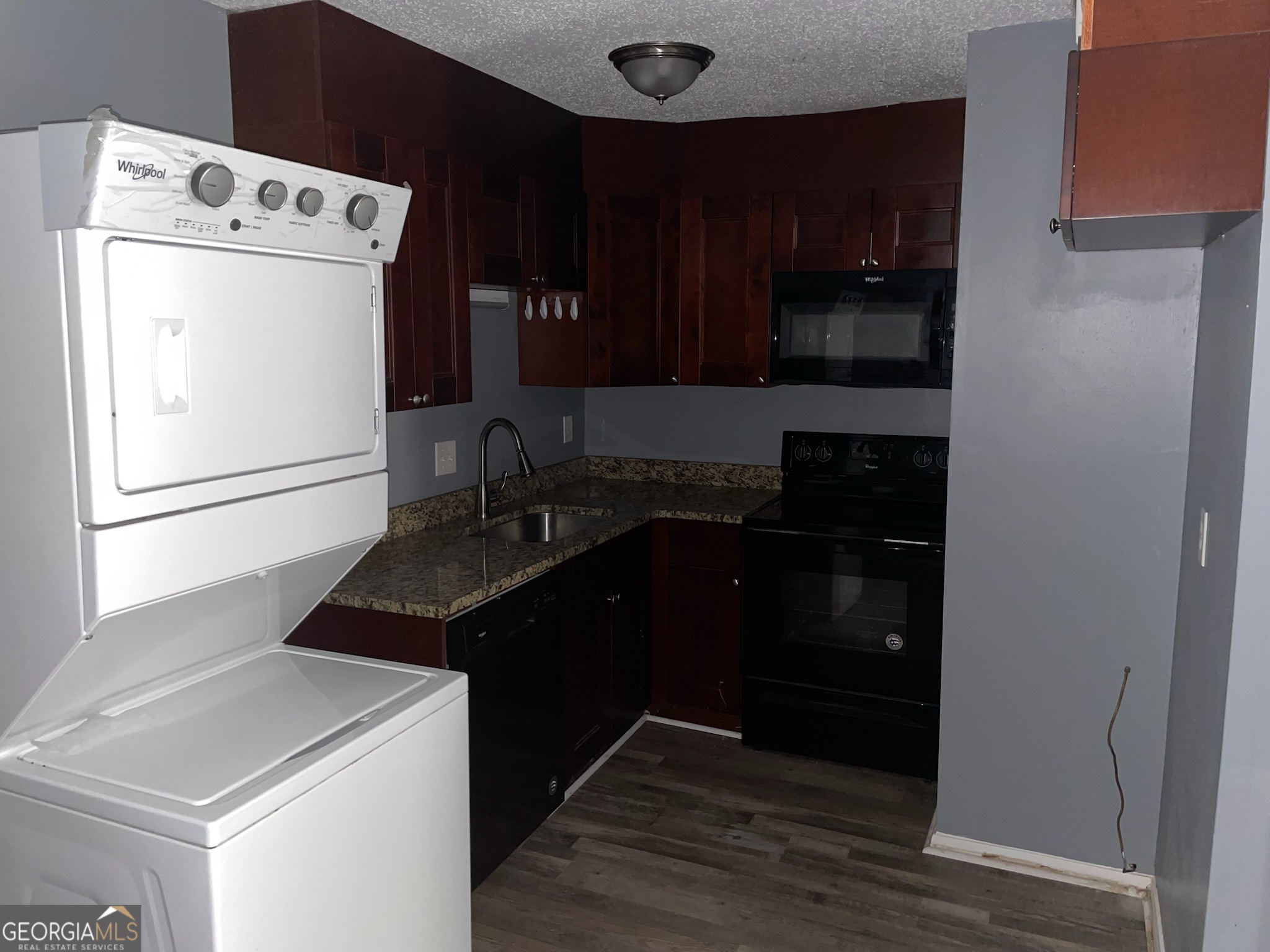 4701 Flat Shoals Road, Unit 25F Union City, GA 30291 - Photo 4 of 21 a kitchen with a sink and a refrigerator