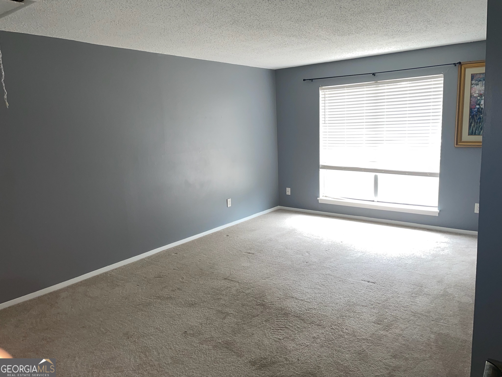 4701 Flat Shoals Road, Unit 25F Union City, GA 30291 - Photo 8 of 21 an empty room with a window