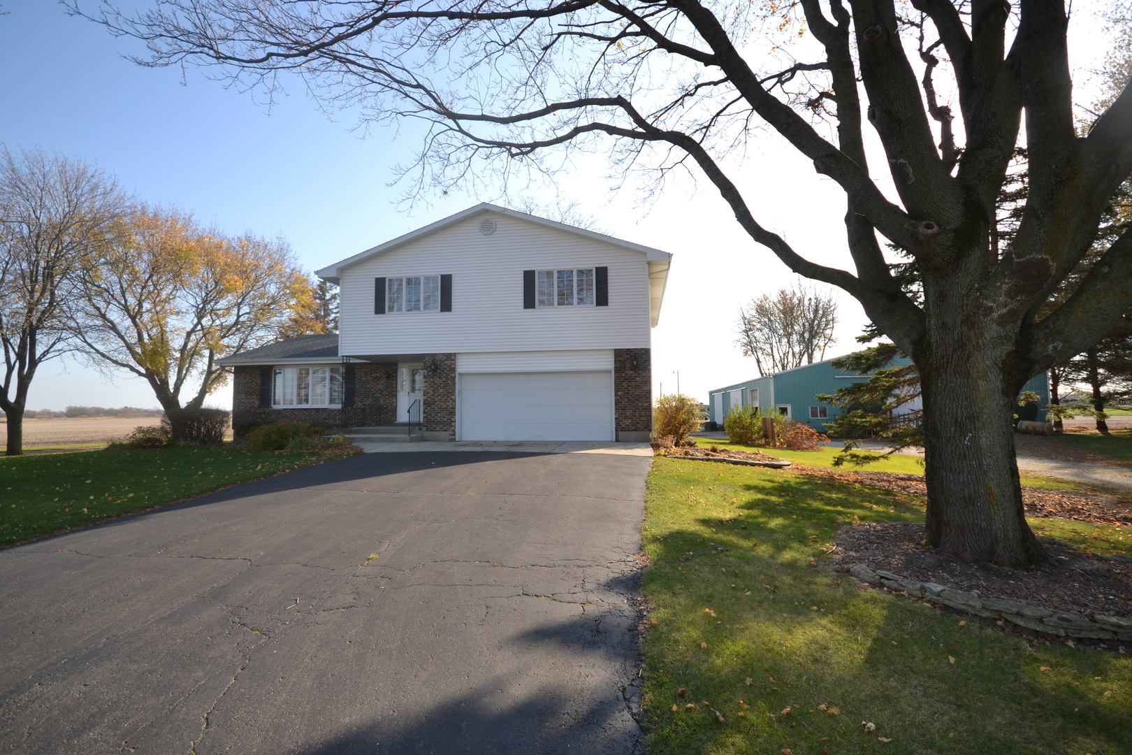 42W665 Plato Road Elgin, IL 60124 - Photo 1 of 38 a front view of house with yard and trees