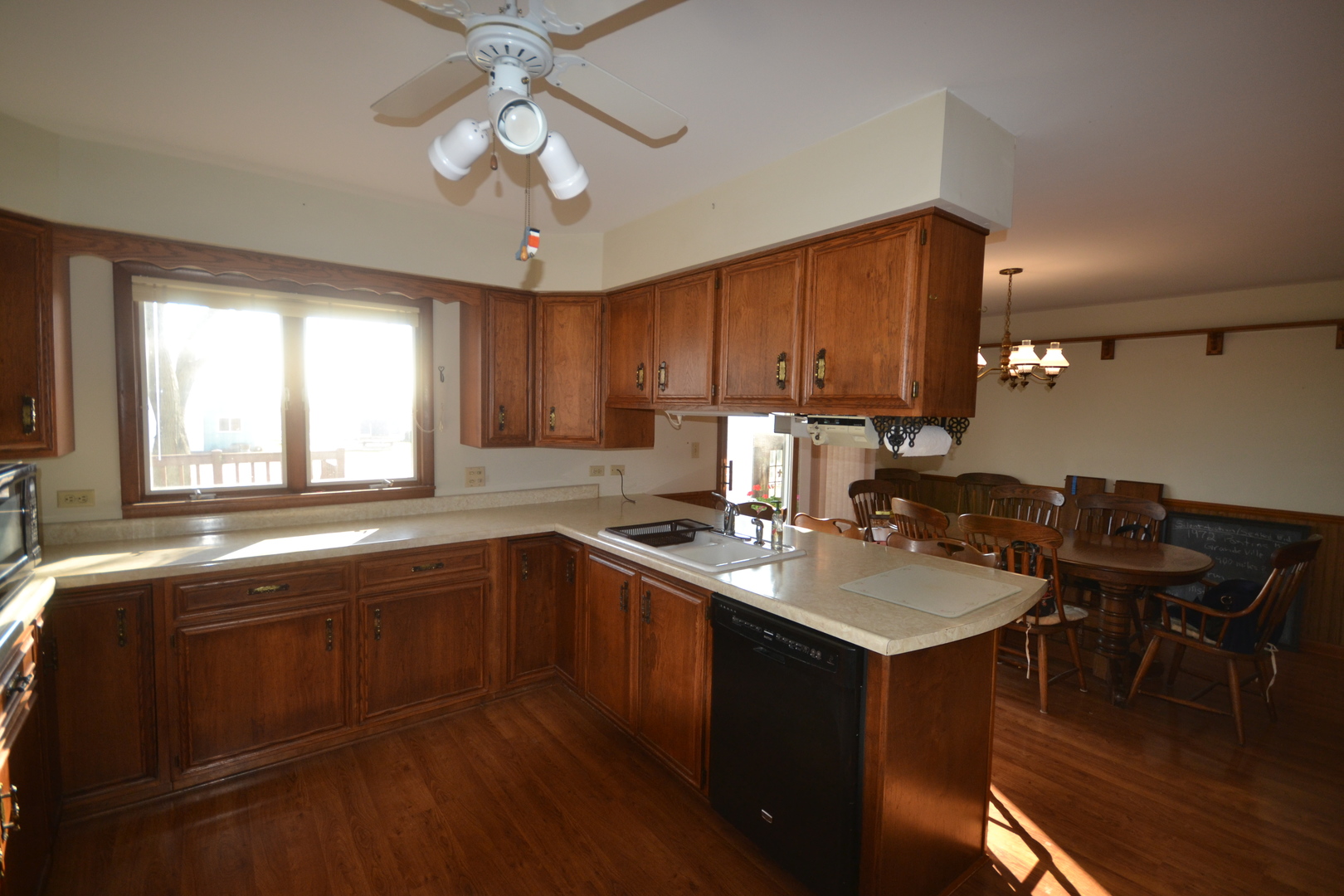 42W665 Plato Road Elgin, IL 60124 - Photo 7 of 38 a kitchen with a stove a sink a dining table and chairs