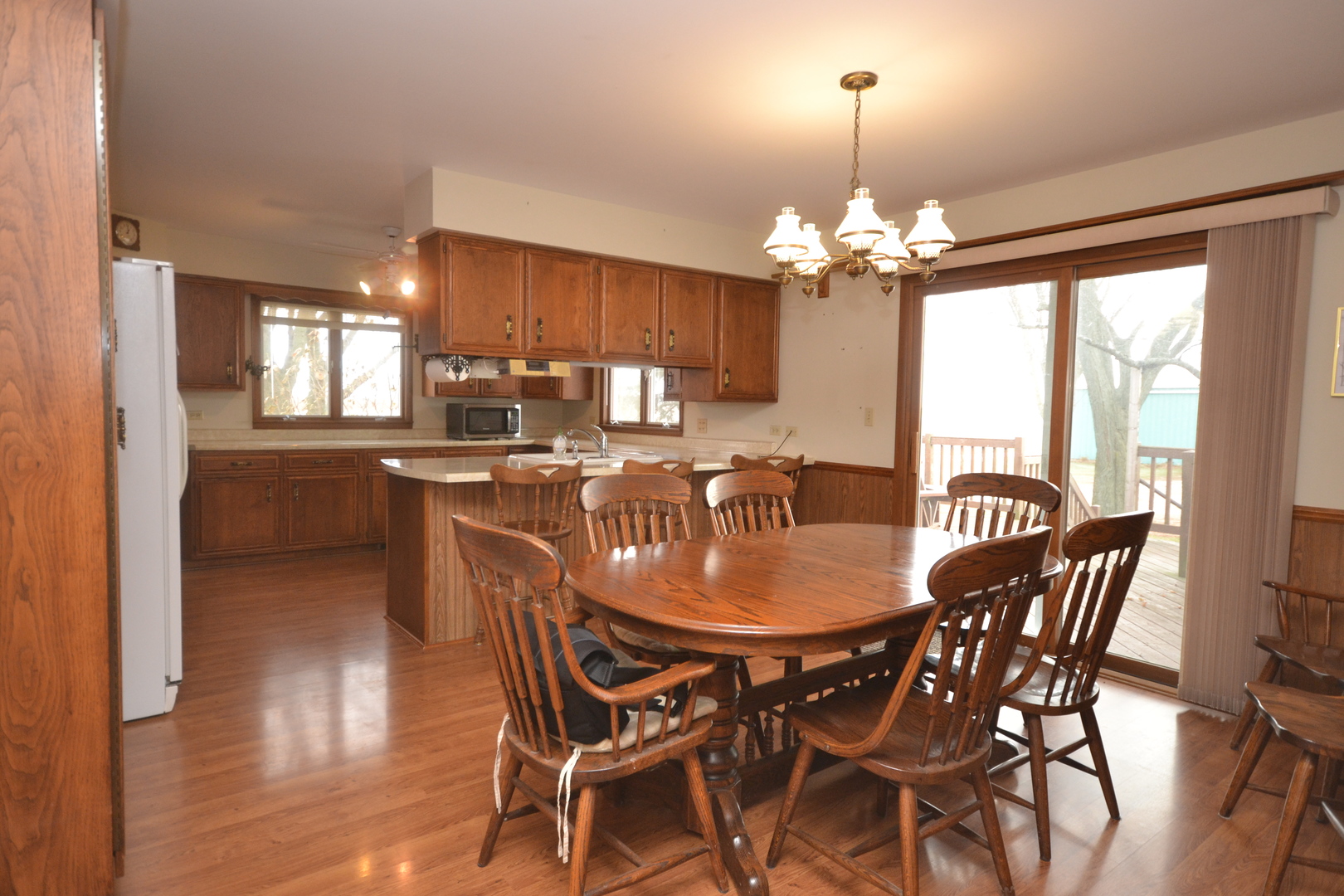 42W665 Plato Road Elgin, IL 60124 - Photo 9 of 38 a dining room with furniture a chandelier and window