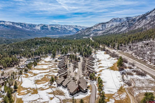 a view of a city with mountains in the background