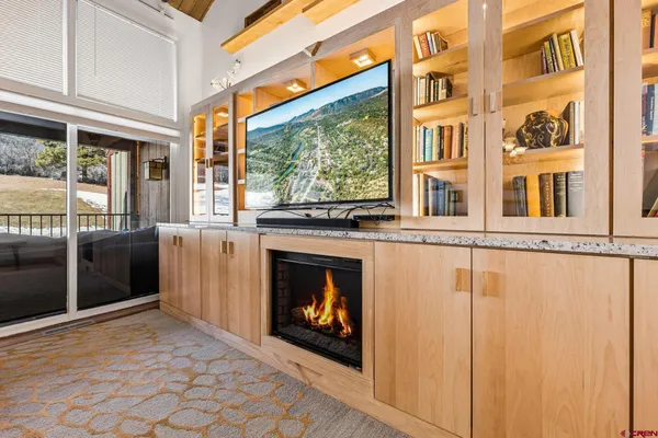 a view of a fireplace with a large window