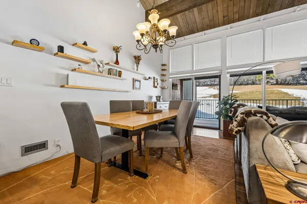 a view of a dining room with furniture